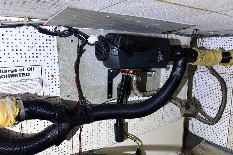 Slide: The Image of Engine room of 1981 Hershine 40 boat with ventilation system and wiring. - 26