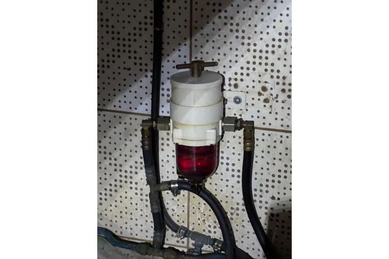 Slide: The Image of Fuel filter system in a 1981 Hershine 40 boat, mounted on a perforated wall. - 27