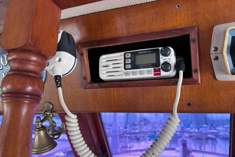 Slide: The Image of 1981 Hershine 40 boat interior with Uniden Solara DSC marine radio and nautical decor. - 40