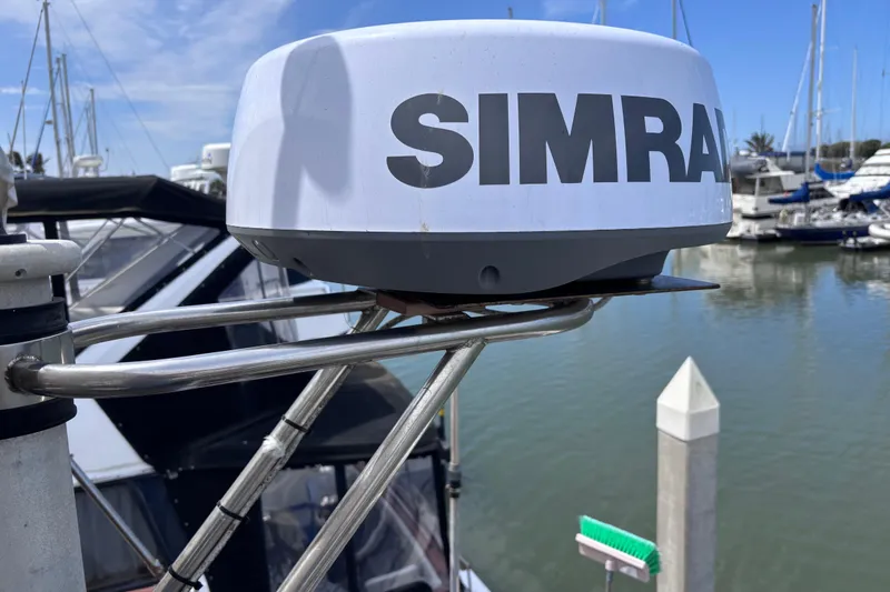 Slide: The Image of Simrad radar on 1981 Hershine 40 boat docked at marina with clear sky. - 47