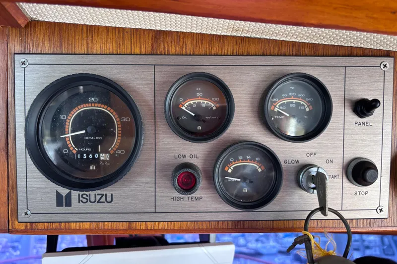 Slide: The Image of Instrument panel of a 1981 Hershine 40 boat with Isuzu gauges and controls. - 38