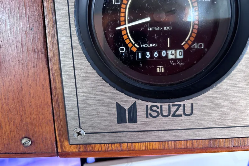 Slide: The Image of Isuzu engine gauge on 1981 Hershine 40, showing 1360.40 hours. - 39