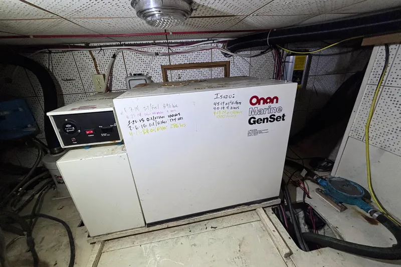 Slide: The Image of Onan Marine GenSet in a 1981 Hershine 40 engine room, with maintenance notes. - 24