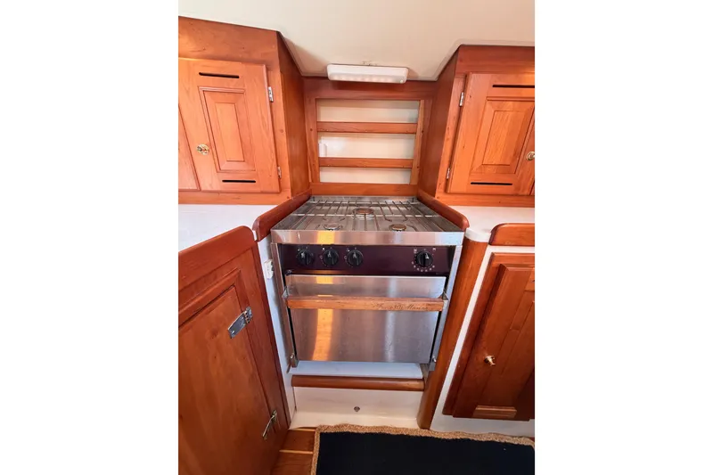 Slide: The Image of Wooden yacht kitchen with stainless steel stove, Tartan 3700, 2002 model. - 67