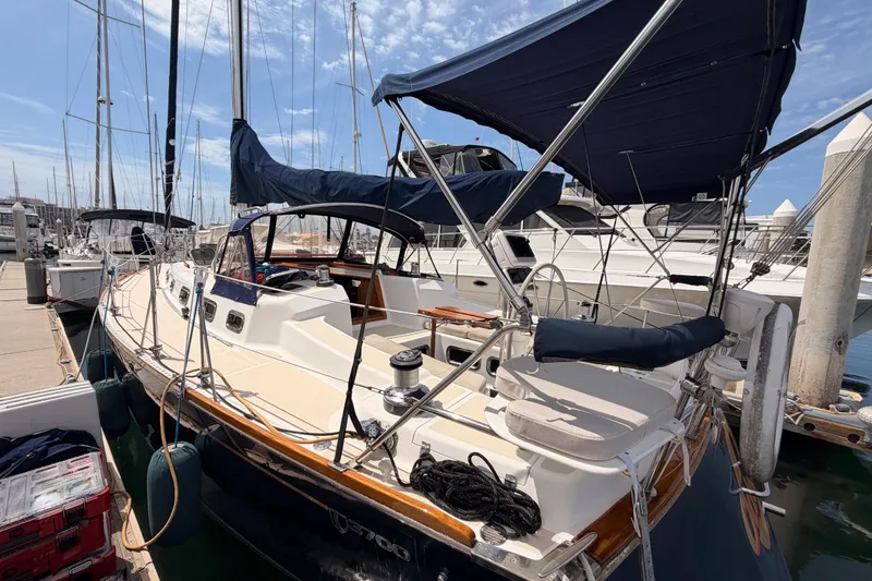 Slide: The Image of Sailboat Tartan 3700, 2002 model, docked at marina under clear blue sky. - 15