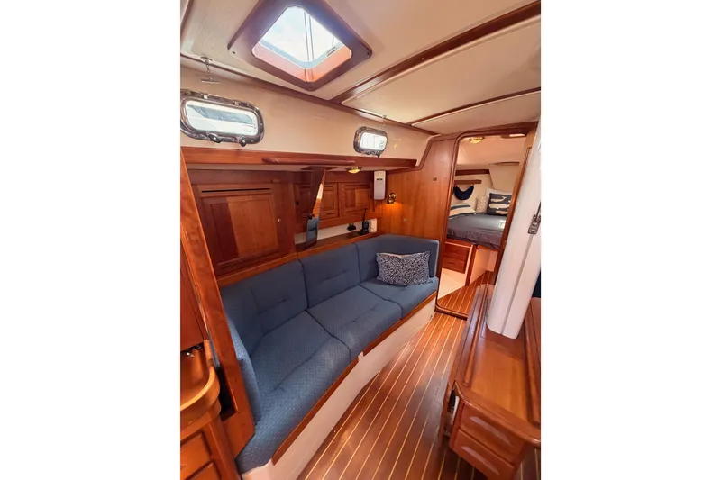 Slide: The Image of Interior of 2002 Tartan 3700 sailboat with cozy seating and wooden finishes. - 82