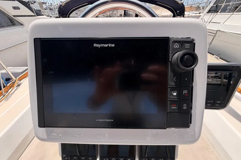 Slide: The Image of Raymarine HybridTouch display on a 2002 Tartan 3700 sailboat, docked in a marina. - 38