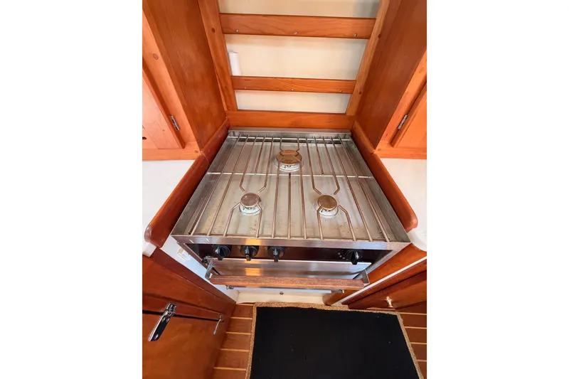 Slide: The Image of Stainless steel stove in a 2002 Tartan 3700 yacht kitchen. - 68