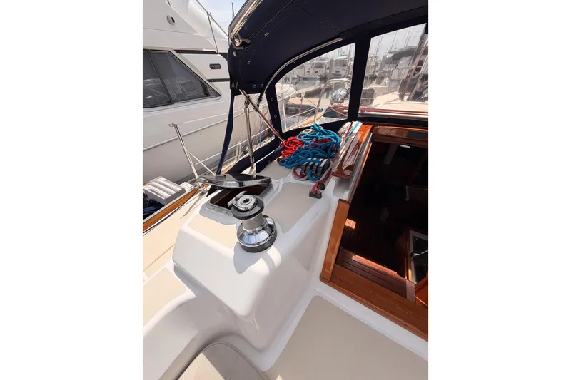 Slide: The Image of Tartan 3700 sailboat cockpit with winch and ropes, 2002 model. - 44
