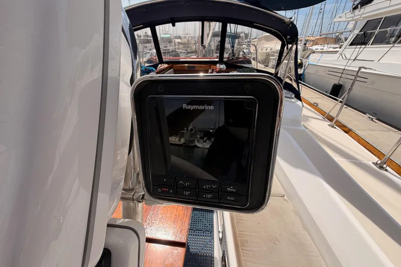Slide: The Image of Raymarine navigation system on a 2002 Tartan 3700 yacht, docked at a marina. - 40