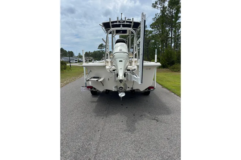 Slide: The Image of Rear view of a 2020 Carolina Skiff 21 LS boat on a road. - 3
