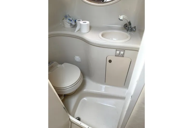 Slide: The Image of 2006 Searay 290 AMBERJACK boat bathroom with toilet, sink, and storage. - 26