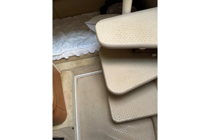 Slide: The Image of Interior cabin of 2006 Searay 290 AMBERJACK with beige carpet and bedding. - 25