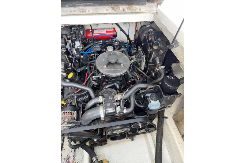 Slide: The Image of Engine compartment of a 2006 Searay 290 AMBERJACK boat, showing detailed components. - 21