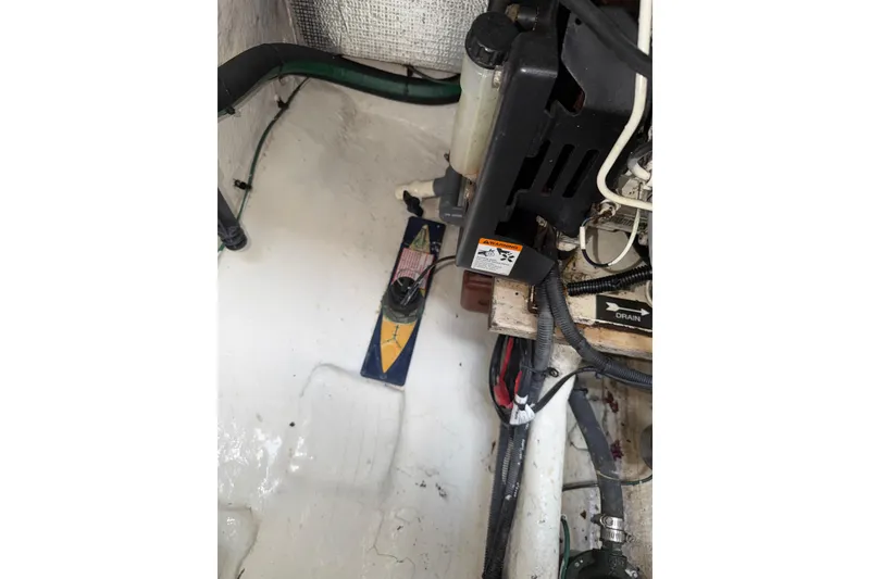 Slide: The Image of Engine compartment of 2006 Searay 290 AMBERJACK with visible components and wiring. - 23