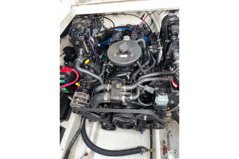 Slide: The Image of Engine compartment of a 2006 Searay 290 AMBERJACK boat, showing detailed components. - 22