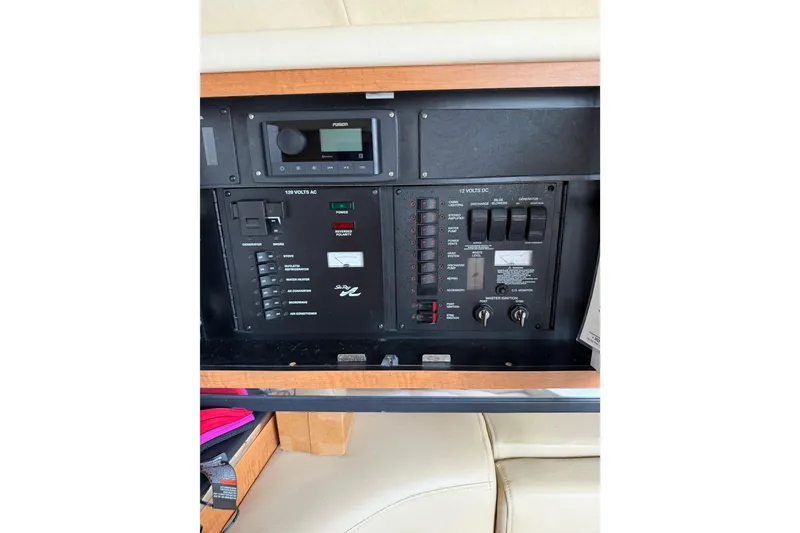 Slide: The Image of Control panel of 2006 Searay 290 AMBERJACK boat with various switches and controls. - 24