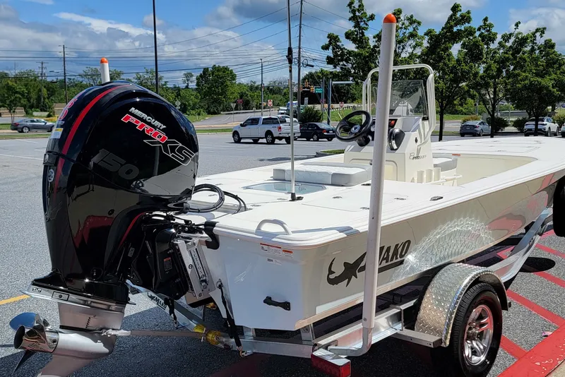 Slide: The Image of 2026 Mako 18 Pro Skiff boat with Mercury Pro XS engine on trailer. - 3