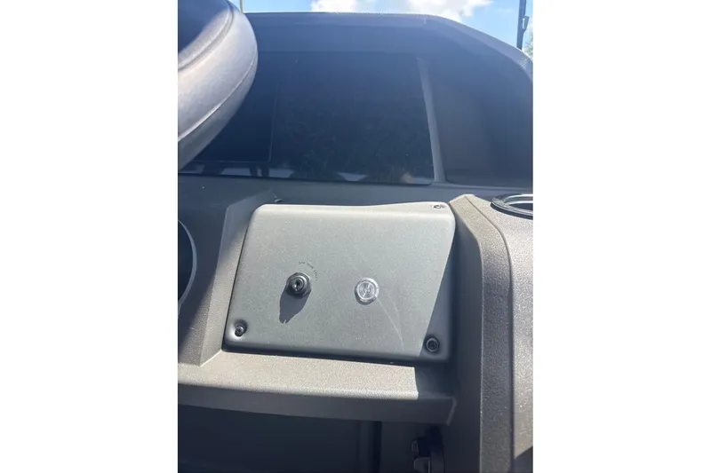 Slide: The Image of Dashboard of 2026 Sun Tracker Sportfish 24 XP3 boat, featuring control panel. - 13