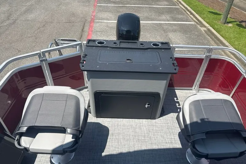Slide: The Image of 2026 Sun Tracker Sportfish 24 XP3 pontoon boat interior with seating and control panel. - 9