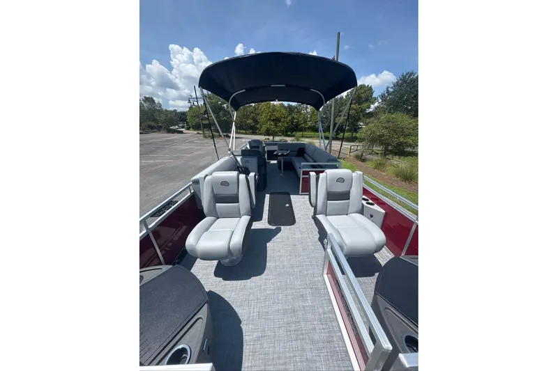 Slide: The Image of 2026 Sun Tracker Sportfish 24 XP3 pontoon boat interior with seating and canopy. - 4
