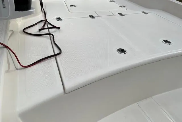Slide: The Image of 2026 Mako Pro Skiff 15 CC boat deck with storage compartments and wiring. - 10
