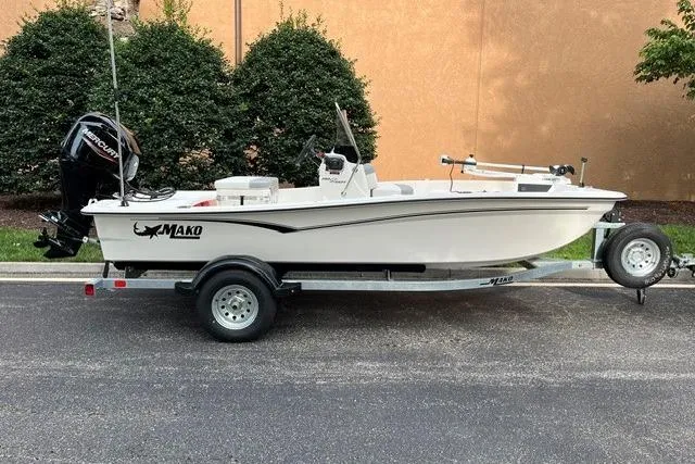 The Image of 2026 Mako Pro Skiff 15 CC boat on trailer, parked outdoors. - 0