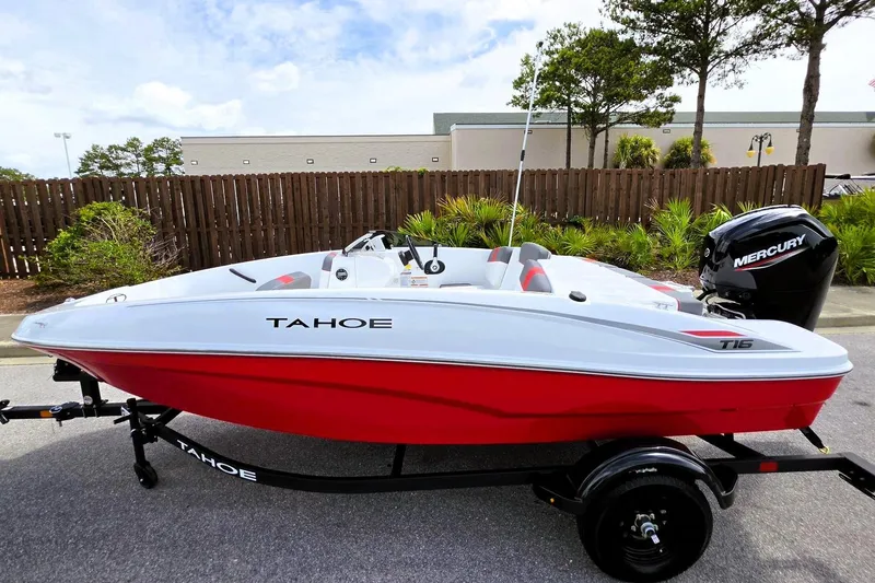 Slide: The Image of 2026 Tahoe T16 boat with red hull and Mercury engine on trailer. - 13