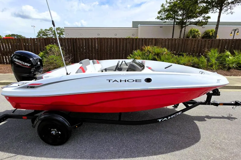 Slide: The Image of 2026 Tahoe T16 boat with red and white design on a trailer. - 6