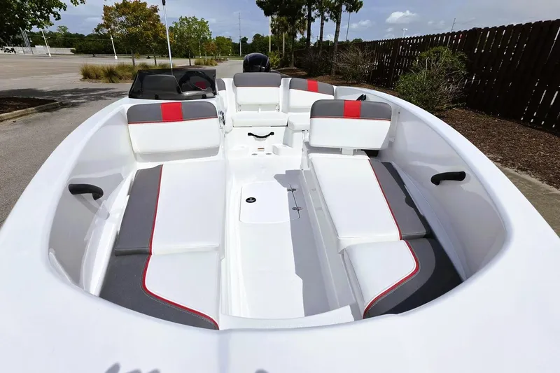 Slide: The Image of 2026 Tahoe T16 boat interior with white and gray seating, red accents, and spacious layout. - 17