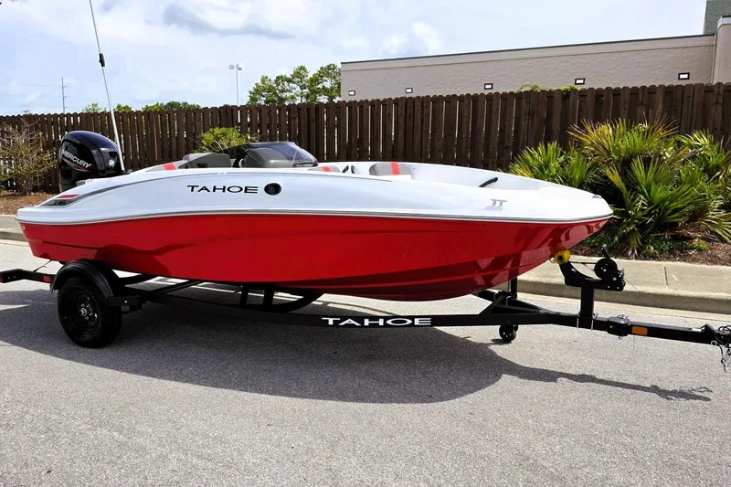 Slide: The Image of 2026 Tahoe T16 boat with red and white design on a trailer, parked outdoors. - 4