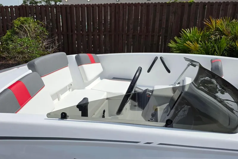 Slide: The Image of 2026 Tahoe T16 boat interior with modern seating and steering wheel design. - 15
