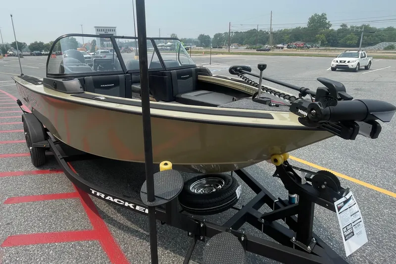 Slide: The Image of 2026 Tracker Targa V-19 Combo boat on trailer in parking lot. - 3