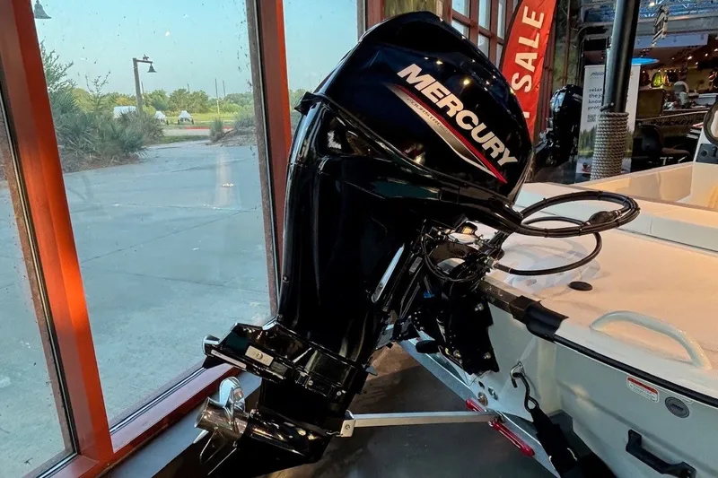 Slide: The Image of 2026 Mako Pro Skiff 13 CC with Mercury outboard motor on display. - 10