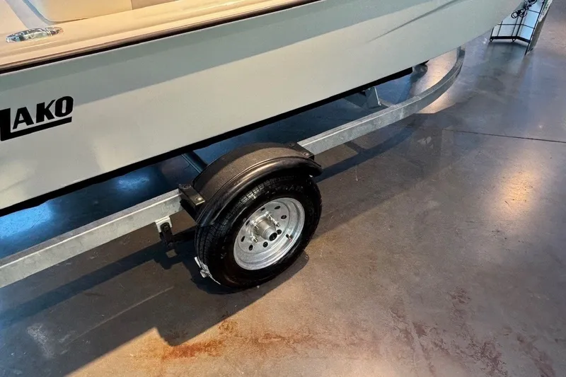 Slide: The Image of 2026 Mako Pro Skiff 13 CC boat on trailer, showcasing sleek design and durable construction. - 8
