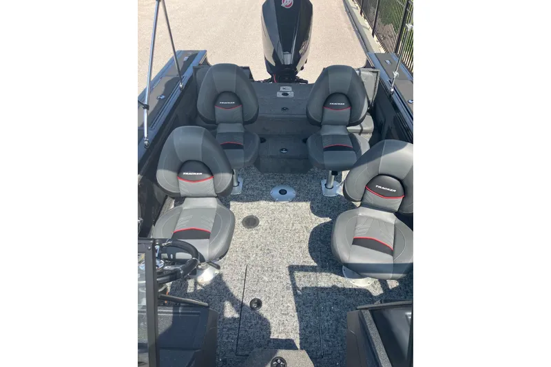 Slide: The Image of 2026 Tracker Targa V-19 Combo boat interior with four gray seats and carpeted floor. - 8