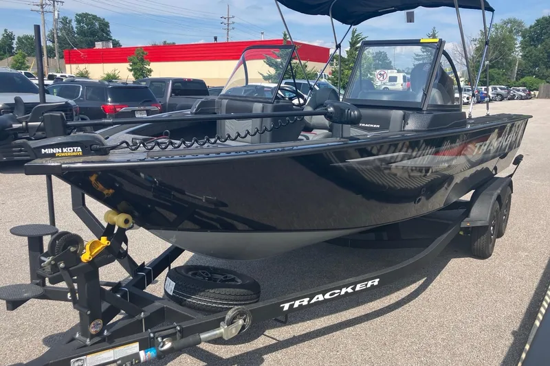 Slide: The Image of 2026 Tracker Targa V-19 Combo boat on trailer in parking lot. - 4