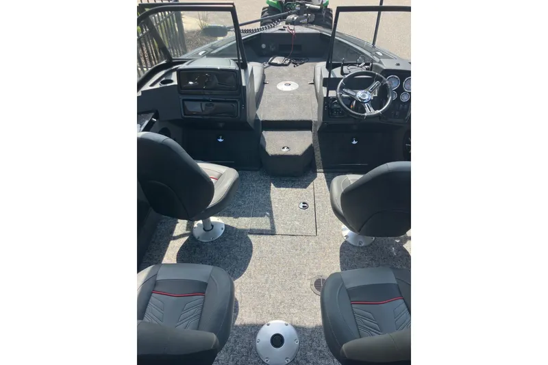 Slide: The Image of Interior of 2026 Tracker Targa V-19 Combo boat with seating and steering console. - 13