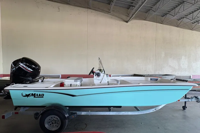Slide: The Image of A 2026 Mako Pro Skiff 17 CC on a trailer in a warehouse. - 6