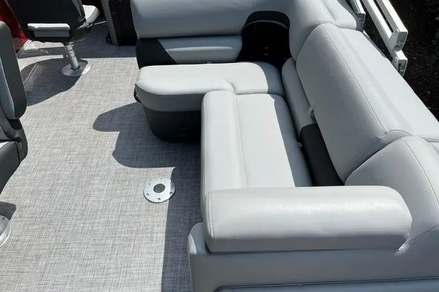Slide: The Image of 2026 Sun Tracker SportFish 22 XP3 boat interior with gray seating and flooring. - 15