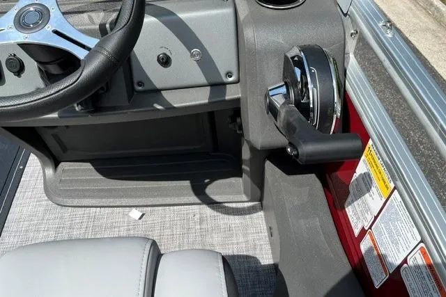 Slide: The Image of Interior view of 2026 Sun Tracker SportFish 22 XP3 boat cockpit with steering wheel and controls. - 10