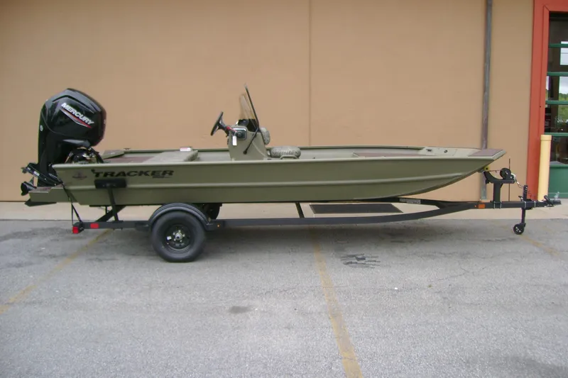 The Image of 2026 Tracker Grizzly 1860 CC boat on trailer, featuring Mercury outboard motor. - 0