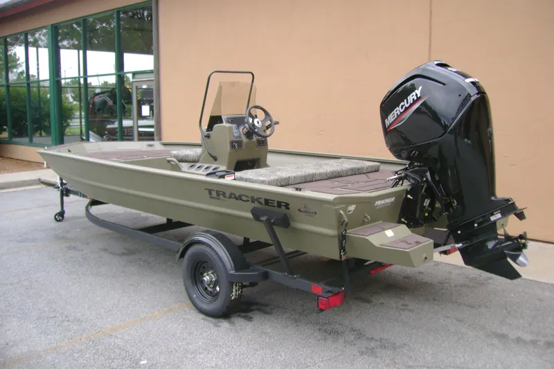 Slide: The Image of 2026 Tracker Grizzly 1860 CC boat with Mercury engine on trailer. - 5