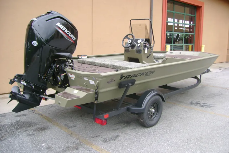 Slide: The Image of 2026 Tracker Grizzly 1860 CC boat with Mercury engine on trailer. - 4