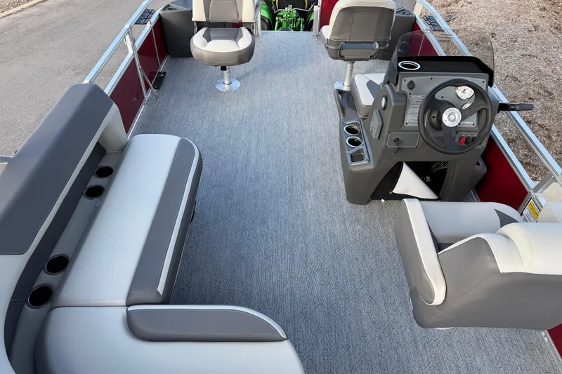 Slide: The Image of 2026 Sun Tracker Bass Buggy 18 DLX interior with seating and steering console. - 4