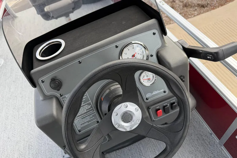 Slide: The Image of Steering console of 2026 Sun Tracker Bass Buggy 18 DLX with gauges and controls. - 3