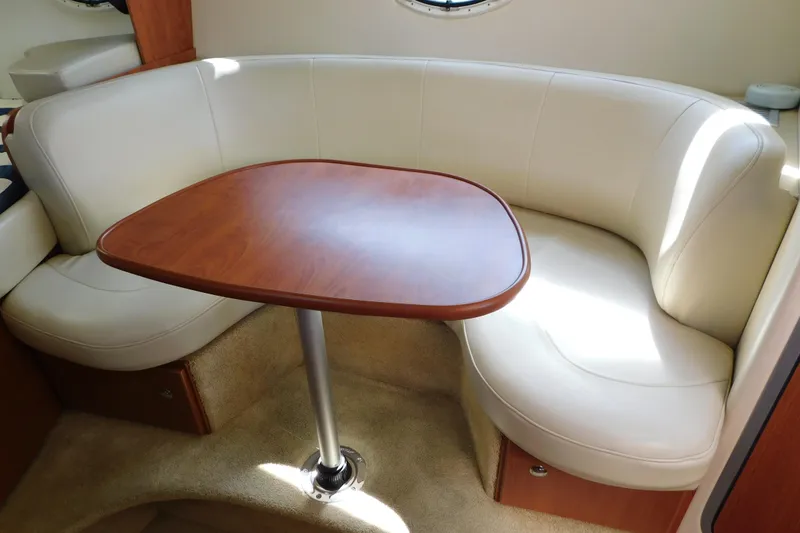 Slide: The Image of Luxurious interior seating area in a 2009 Bayliner 300 boat. - 52