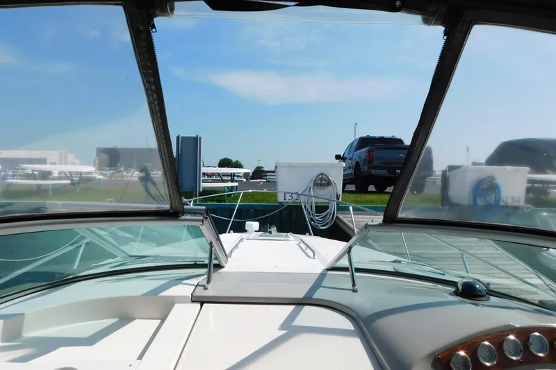 Slide: The Image of 2009 Bayliner 300 boat docked, view from cockpit with clear windshield. - 41