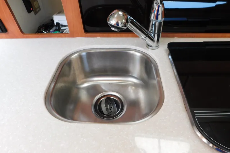 Slide: The Image of Stainless steel sink and faucet in 2009 Bayliner 300 boat kitchen. - 61