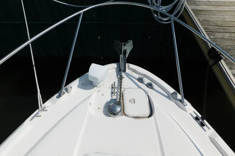 Slide: The Image of Bow of a 2009 Bayliner 300 boat with anchor and deck details. - 43